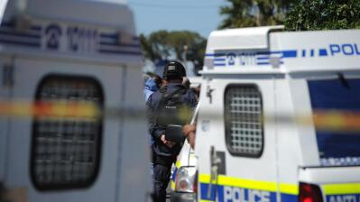 Two SAPS vans at a crime scene