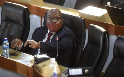 Jacob Zuma wearing a mask sits in a hearing into state capture.