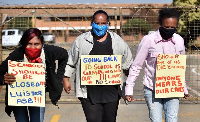 In this July 6, 2020 file photo, a handful of concerned parents picket outside a South African school, calling for it to be shut due to Covid-19. President Cyril Ramaphosa said on July 23  the government had decided to close public schools for all by essential grades from July 27 until August 24. Photo: Thobile Mathonsi/African News Agency (ANA)