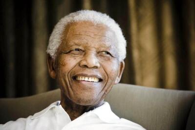 Head shot of a smiling Nelson Mandela
