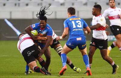 Seabelo Senatla of the Stormers tackled by Pieter Botha of the Lions
