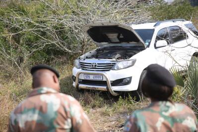 SANDF members next to a white Toyota Fortuner