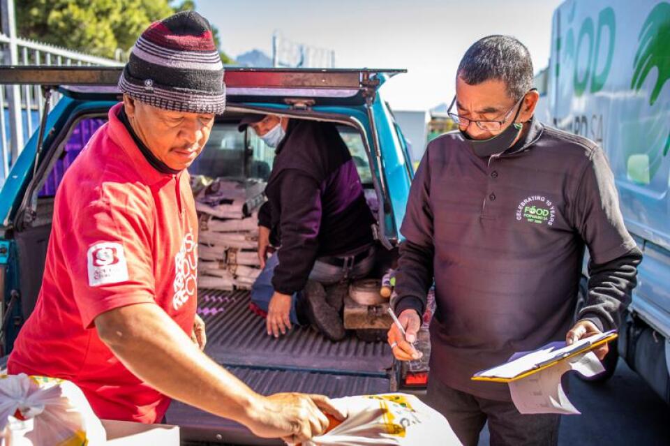 Two men from delivering food for FoodForward SA