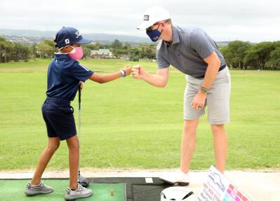 Seven-year-old Aarav Baba gets a fist pump from SA golfer Brandon Stone. 