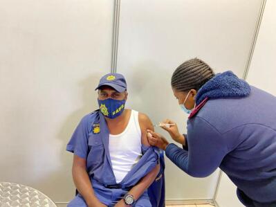 A police officer being injected 