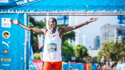 Ugandan Joshua Cheptegei crosses the finish line