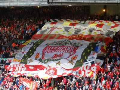 Liverpool football fans at Anfield stadium. 