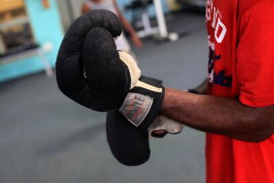 Boxing gloves are seen at The Dube Boxing Club
