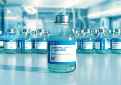 Blue bottles of vaccine in rows.