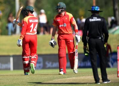 Zimbabwean batsman Sean Williams celebrates his 50 runs