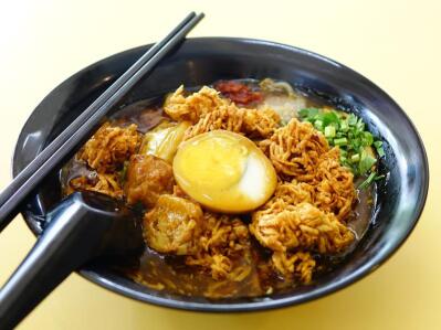 A plate of Asian style food.