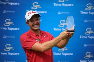 Ruan Corb smiles with his trophy