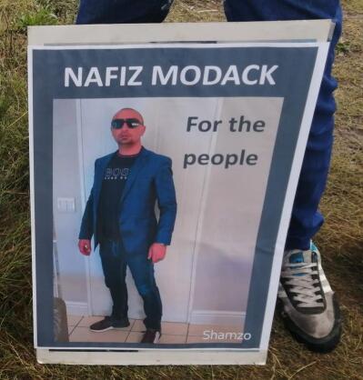 A man with a placard.