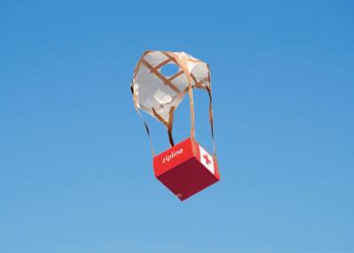 Medical supplies hang from a parachute.
