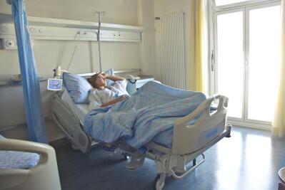 A woman sleeping in a hospital bed