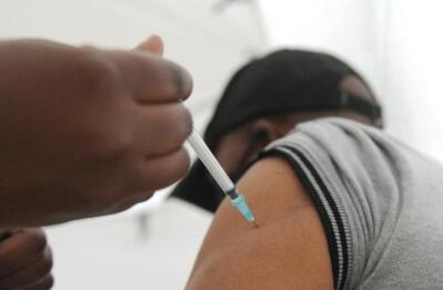 Nurse injects a vaccine.