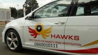 A Hawks branded white vehicle