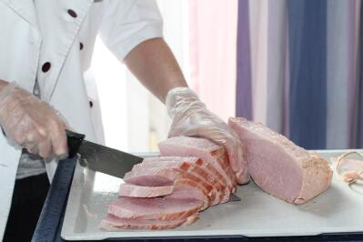 Meat being sliced.