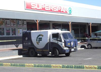 A Fidelity cash in transit vehicle parked outside a Superspar store