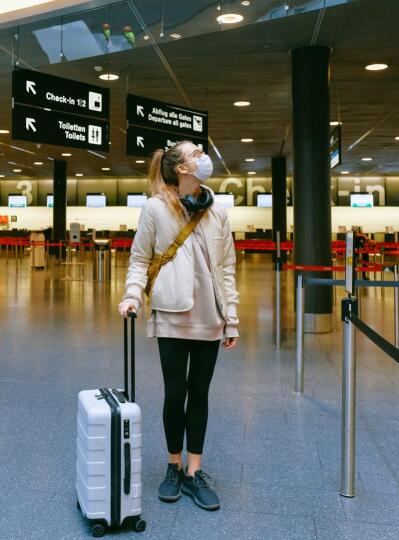 A young woman inside the airport