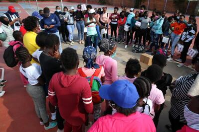 SA netball captain Bongi Msomi talking to a crowd of young girls